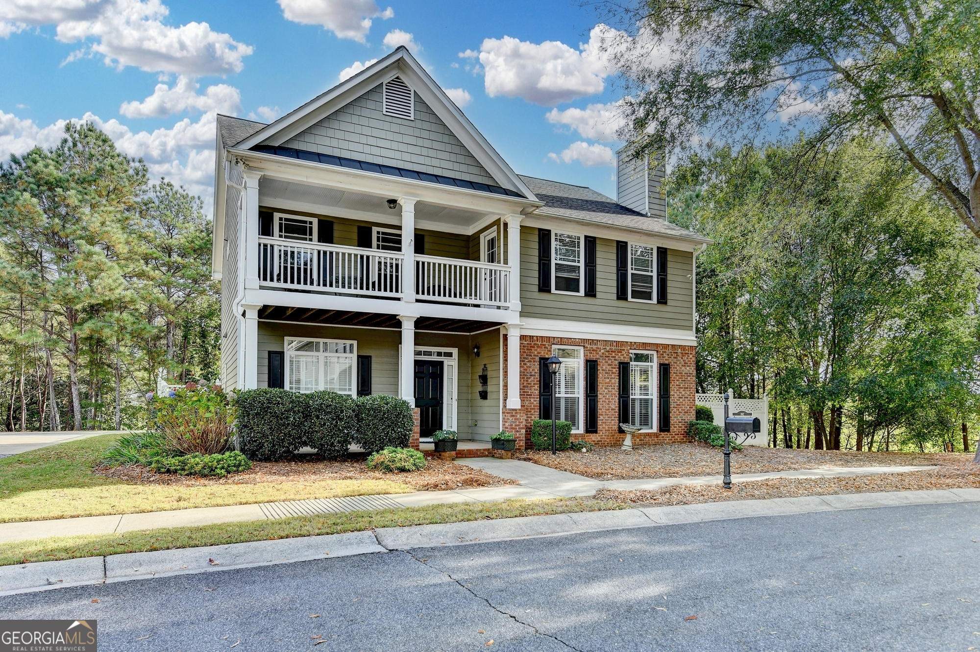 952 Cambron Cmns Trace Suwanee, GA 30024 - Photo 2 of 69 a front view of a house with a yard