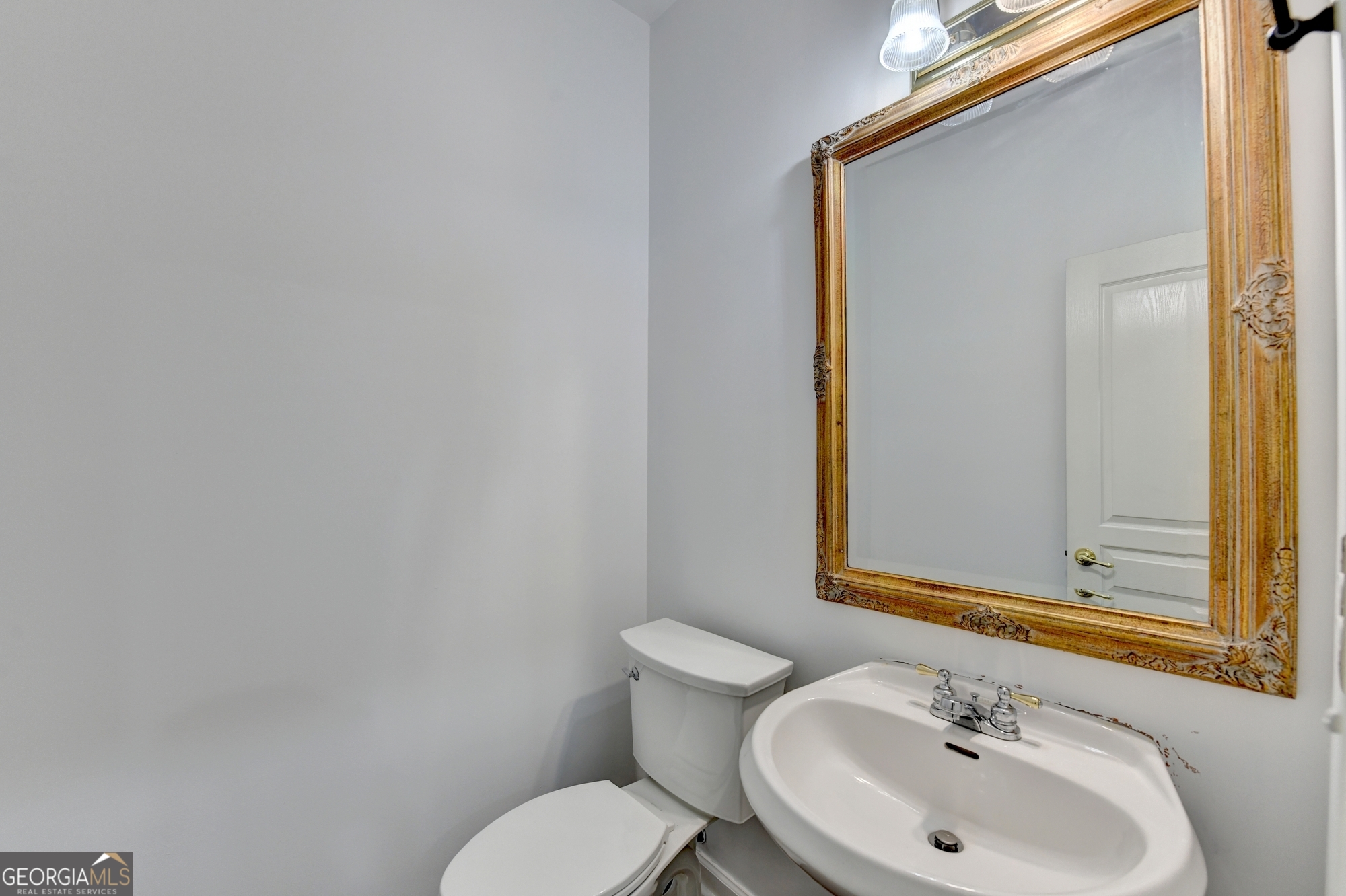 952 Cambron Cmns Trace Suwanee, GA 30024 - Photo 21 of 69 a bathroom with a sink and a mirror