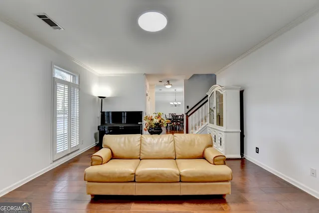 a spacious bathroom with a double vanity sink a mirror and a bathtub