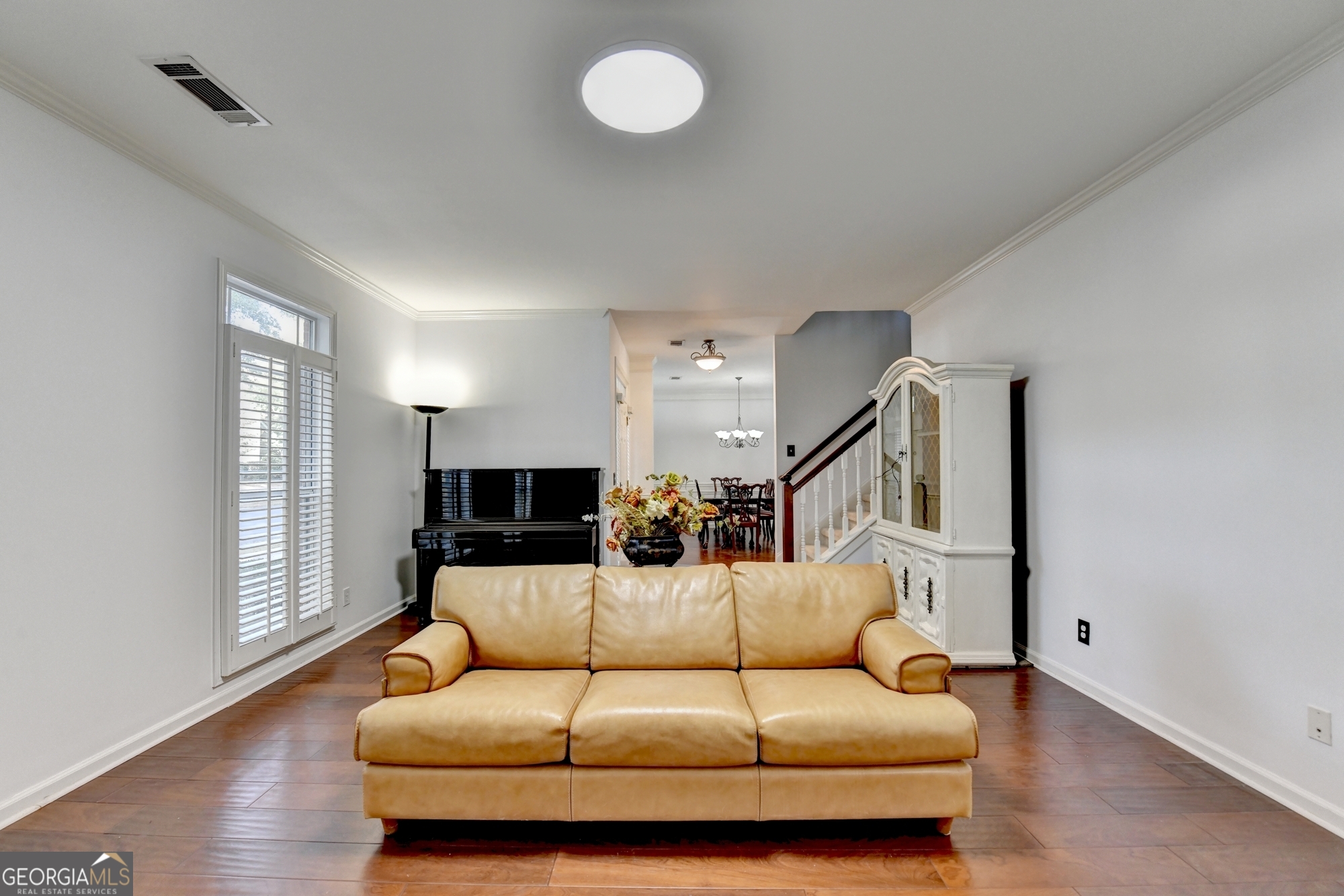 952 Cambron Cmns Trace Suwanee, GA 30024 - Photo 25 of 69 a living room with furniture and a flat screen tv