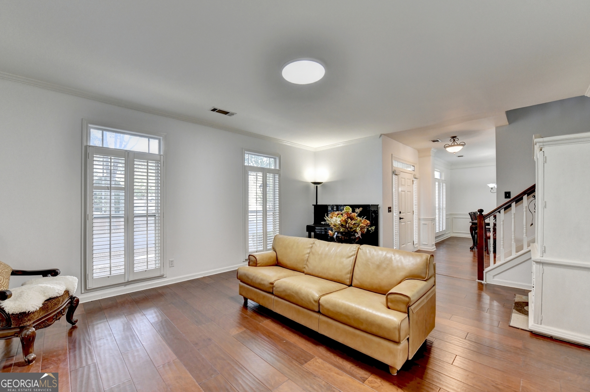 952 Cambron Cmns Trace Suwanee, GA 30024 - Photo 26 of 69 a living room with furniture and a wooden floor