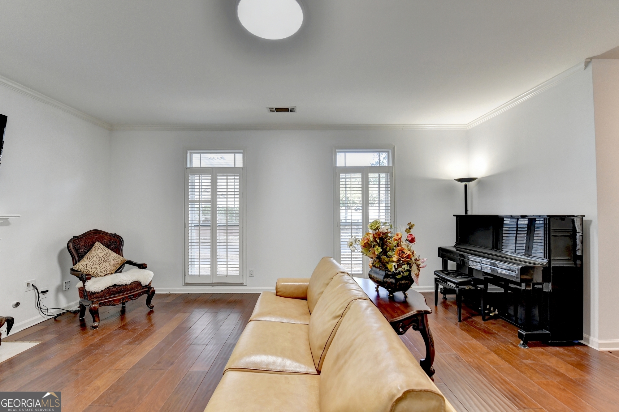952 Cambron Cmns Trace Suwanee, GA 30024 - Photo 27 of 69 a living room with furniture piano and a potted plant
