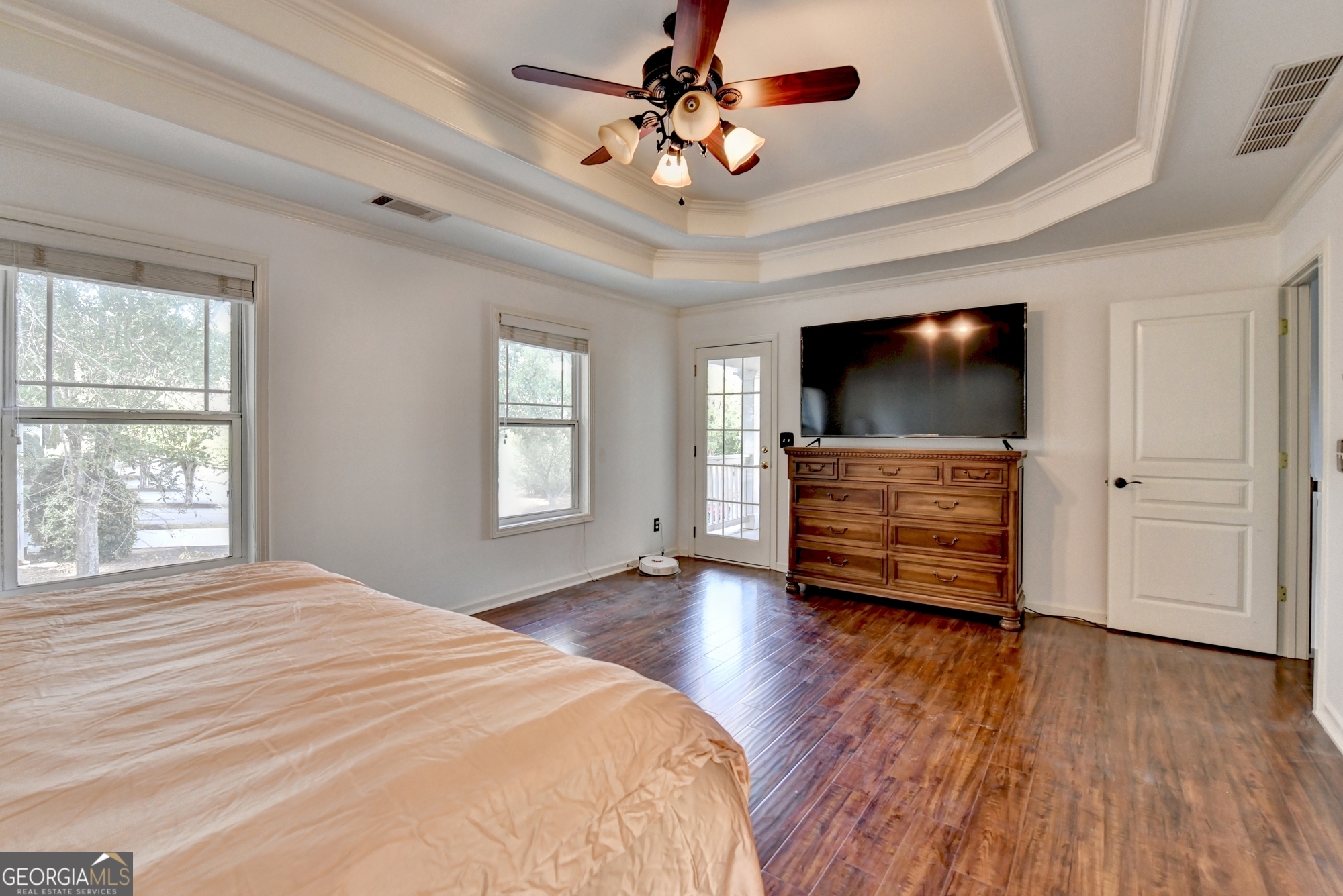 952 Cambron Cmns Trace Suwanee, GA 30024 - Photo 31 of 69 a bedroom with furniture and flat screen tv