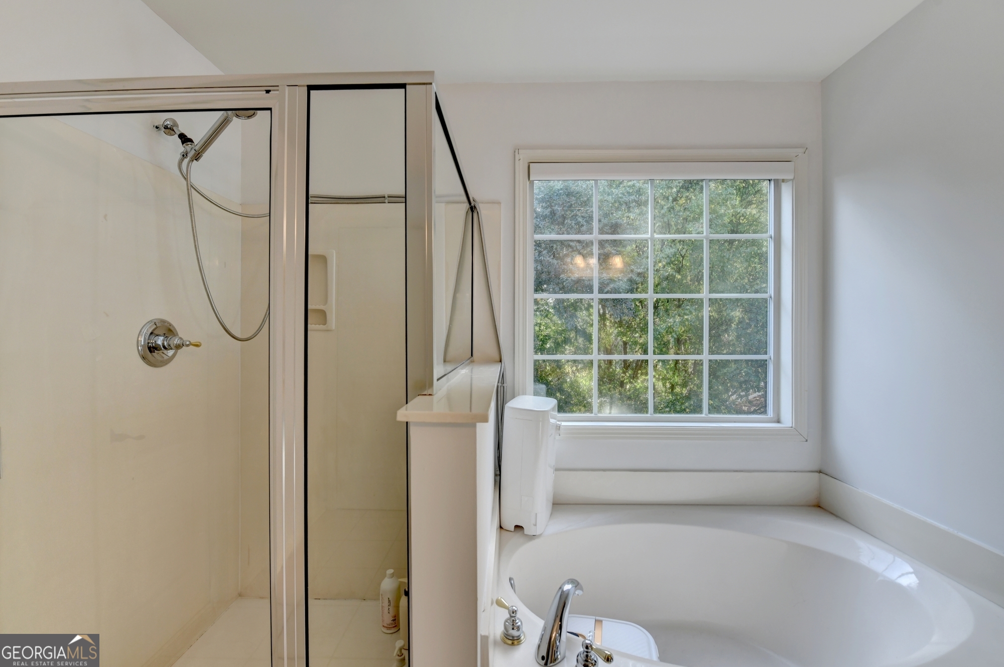 952 Cambron Cmns Trace Suwanee, GA 30024 - Photo 35 of 69 a bathroom with a shower and a window