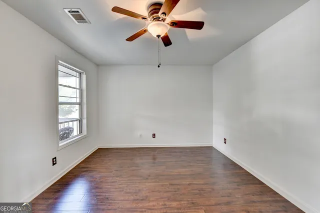 a view of patio with table and chairs potted plants