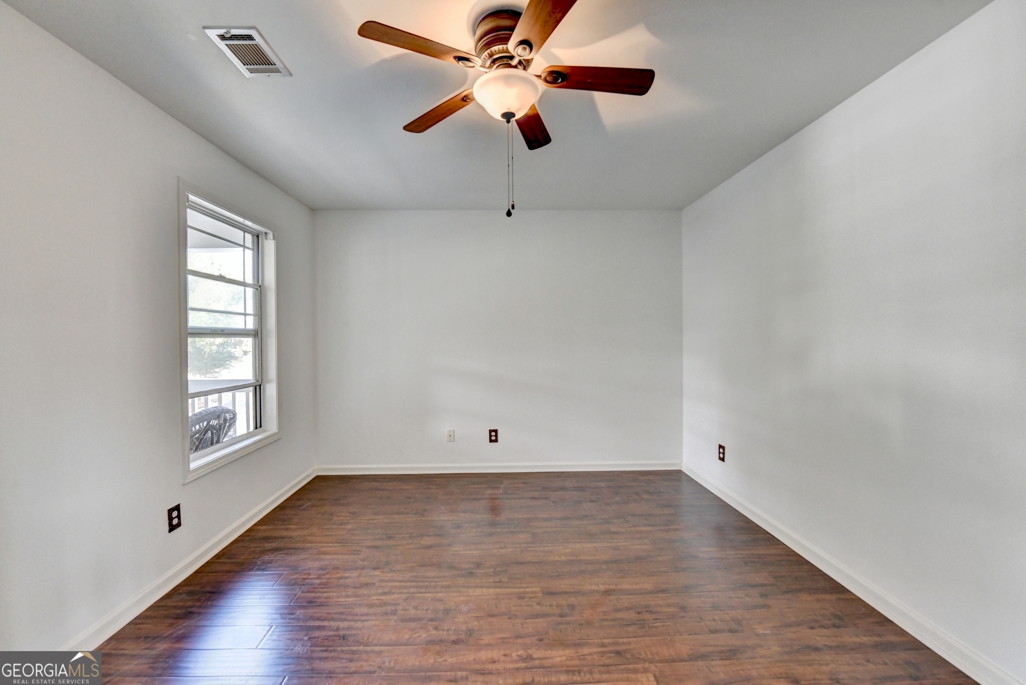 952 Cambron Cmns Trace Suwanee, GA 30024 - Photo 41 of 69 wooden floor in an empty room with a window