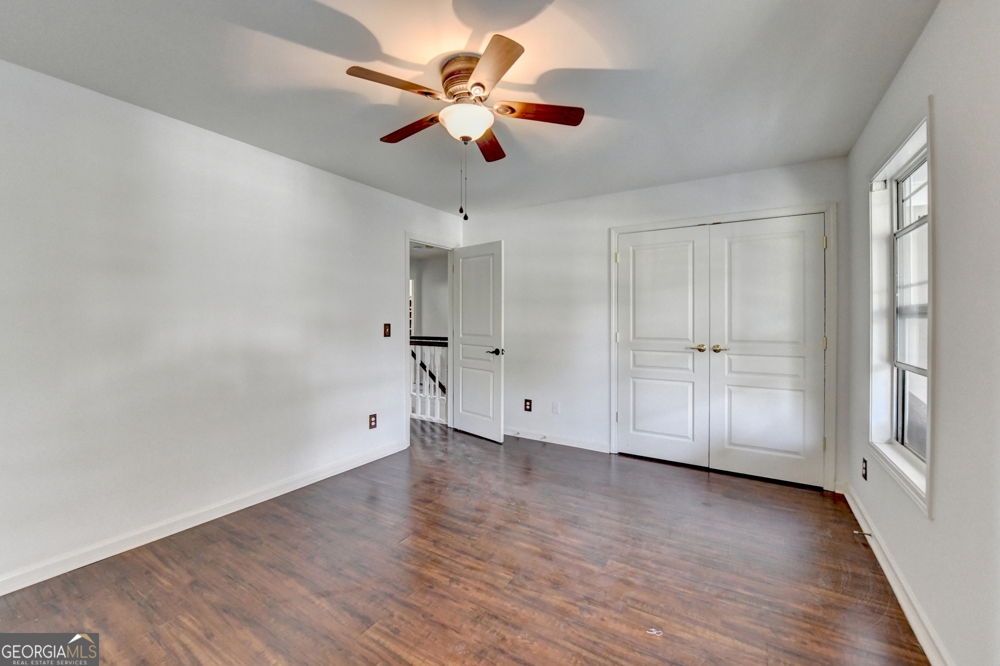 952 Cambron Cmns Trace Suwanee, GA 30024 - Photo 42 of 69 wooden floor in an empty room with a window