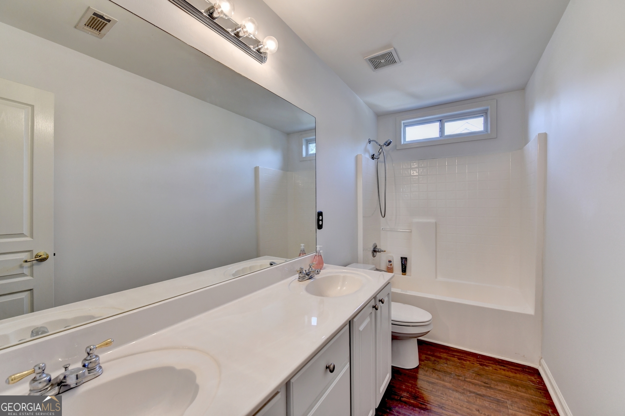 952 Cambron Cmns Trace Suwanee, GA 30024 - Photo 44 of 69 a bathroom with a sink a toilet and shower