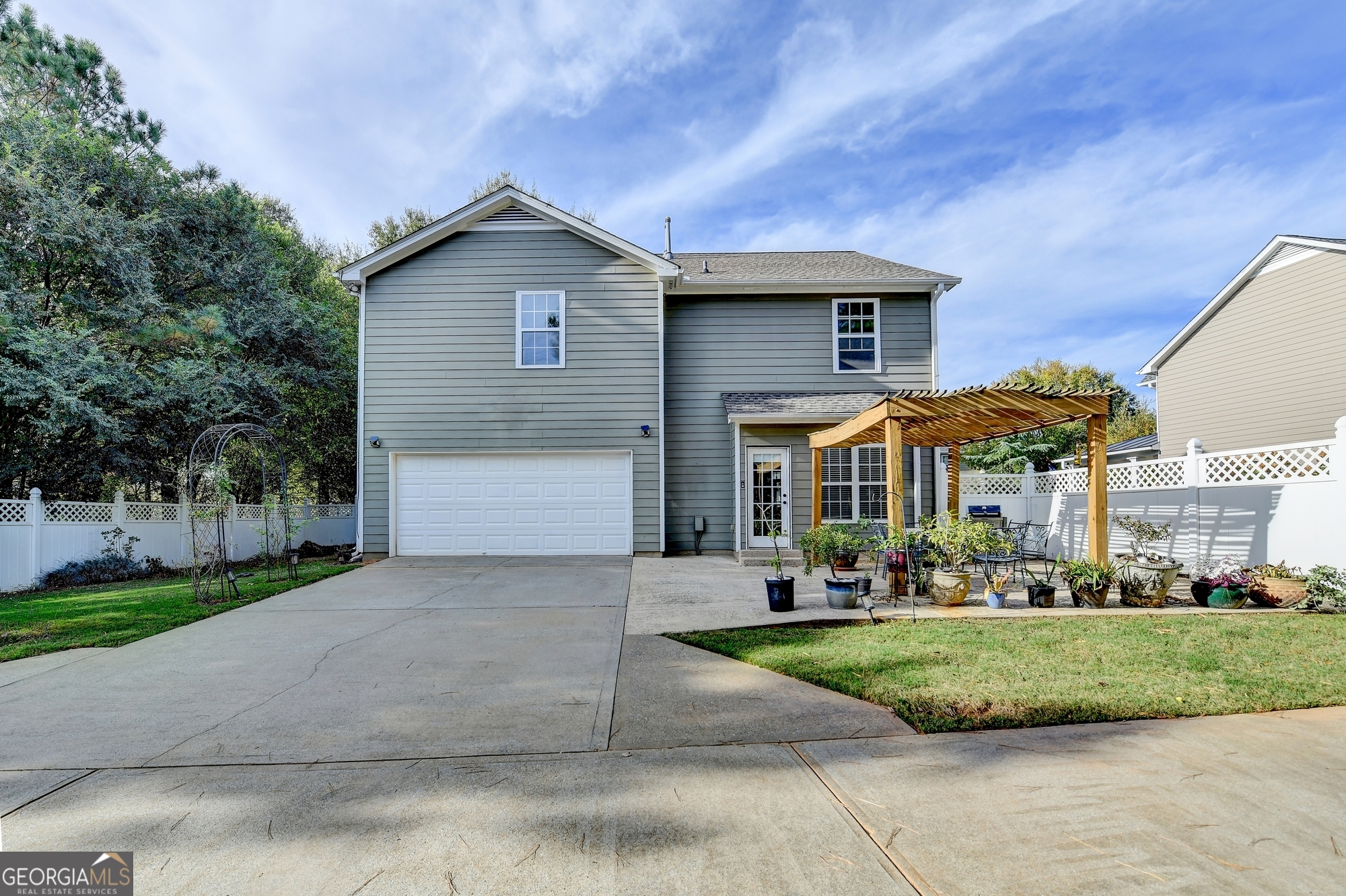 952 Cambron Cmns Trace Suwanee, GA 30024 - Photo 54 of 69 a front view of a house with a yard