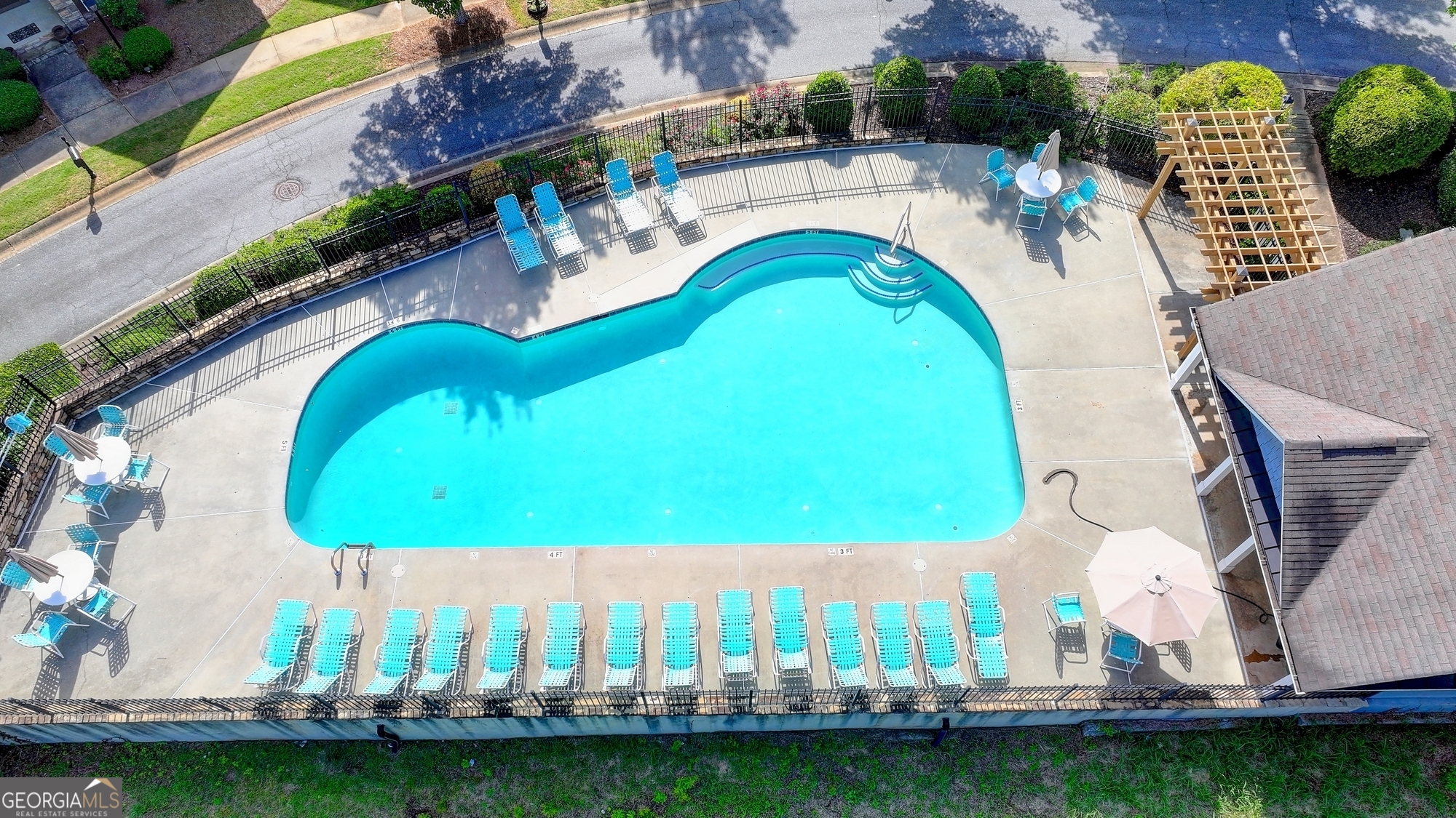952 Cambron Cmns Trace Suwanee, GA 30024 - Photo 56 of 69 an aerial view of a house with a swimming pool
