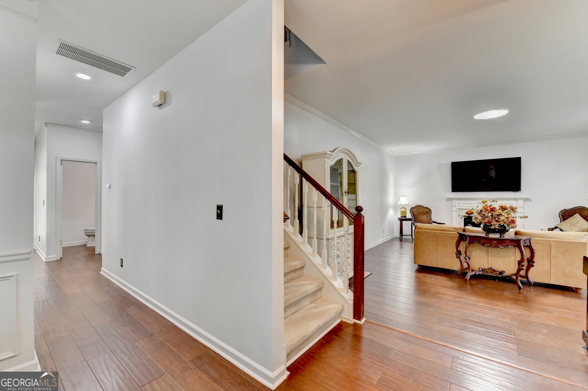 952 Cambron Cmns Trace Suwanee, GA 30024 - Photo 8 of 69 a living room with furniture and flat screen tv