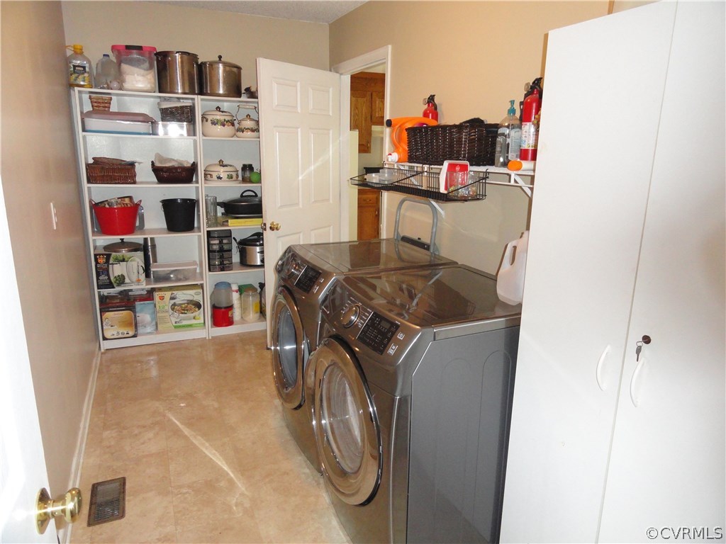 18670 Templeton Road Disputanta, VA 23842 - Photo 29 of 41 a utility room with dryer and washer