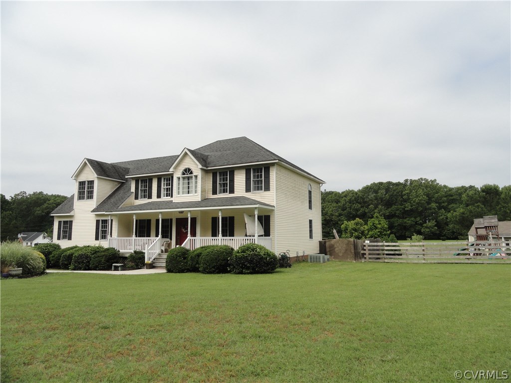 18670 Templeton Road Disputanta, VA 23842 - Photo 3 of 41 a front view of a house with a garden