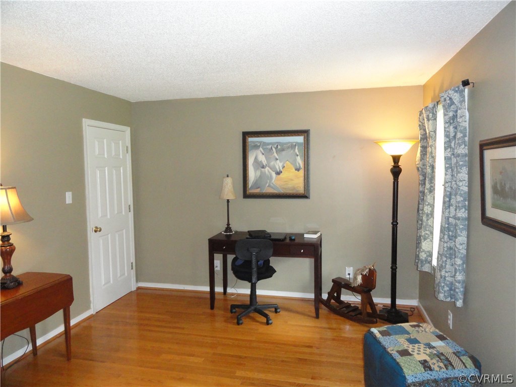 18670 Templeton Road Disputanta, VA 23842 - Photo 6 of 41 a view of a workspace with furniture and wooden floor