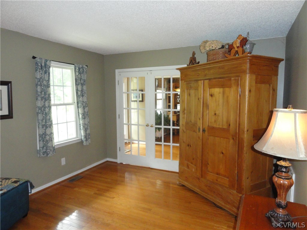 18670 Templeton Road Disputanta, VA 23842 - Photo 7 of 41 a view of empty room with windows and wardrobe