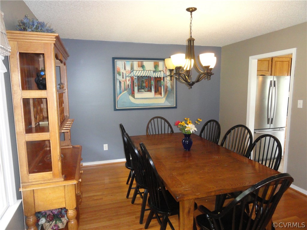 18670 Templeton Road Disputanta, VA 23842 - Photo 8 of 41 a dining room with furniture window and wooden floor