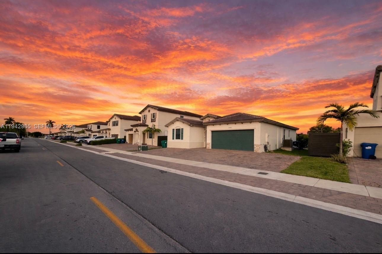 front view of a house with a street