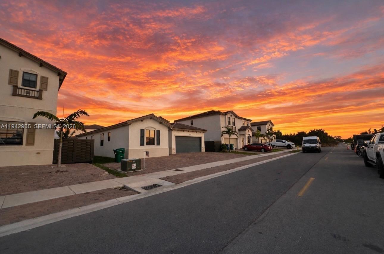23357 Southwest 133rd Avenue Homestead, FL 33032 - Photo 2 of 14 a view of a street with a house