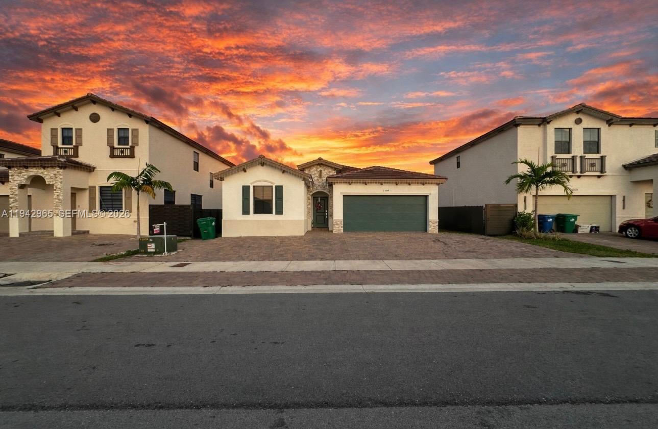 23357 Southwest 133rd Avenue Homestead, FL 33032 - Photo 3 of 14 a front view of a house with a yard
