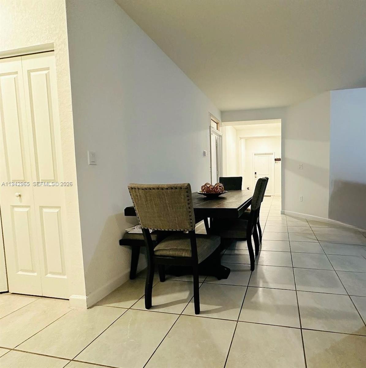 23357 Southwest 133rd Avenue Homestead, FL 33032 - Photo 4 of 14 a view of a dining room with furniture and a window