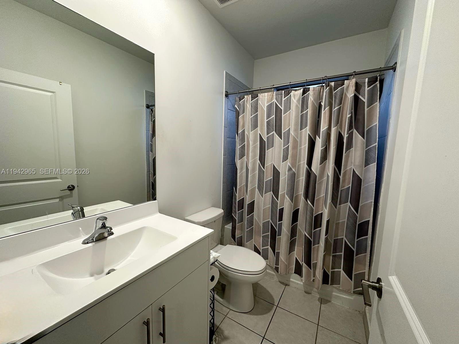 23357 Southwest 133rd Avenue Homestead, FL 33032 - Photo 6 of 14 a bathroom with a sink toilet and shower