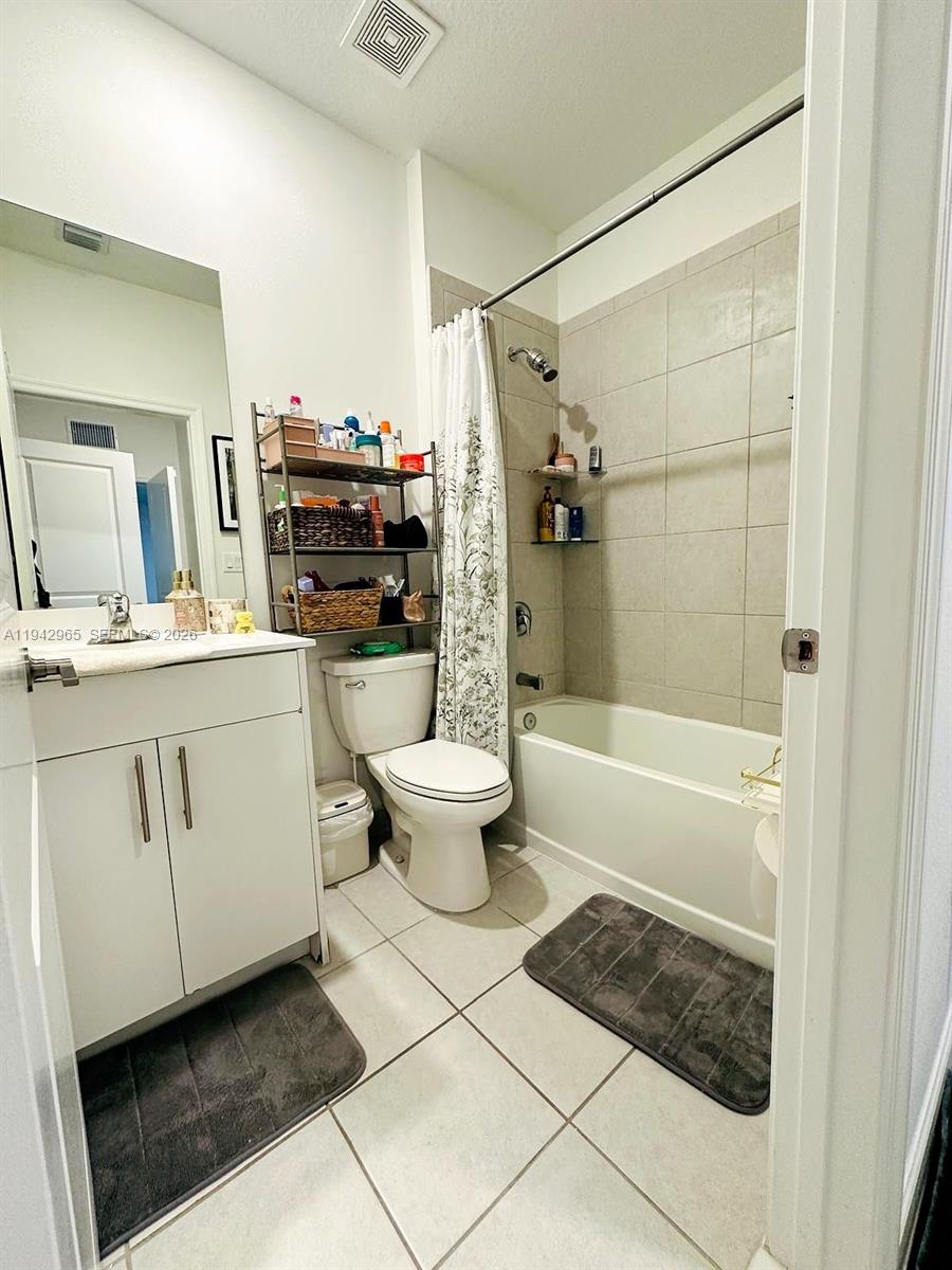 23357 Southwest 133rd Avenue Homestead, FL 33032 - Photo 9 of 14 a bathroom with a sink a toilet and shower