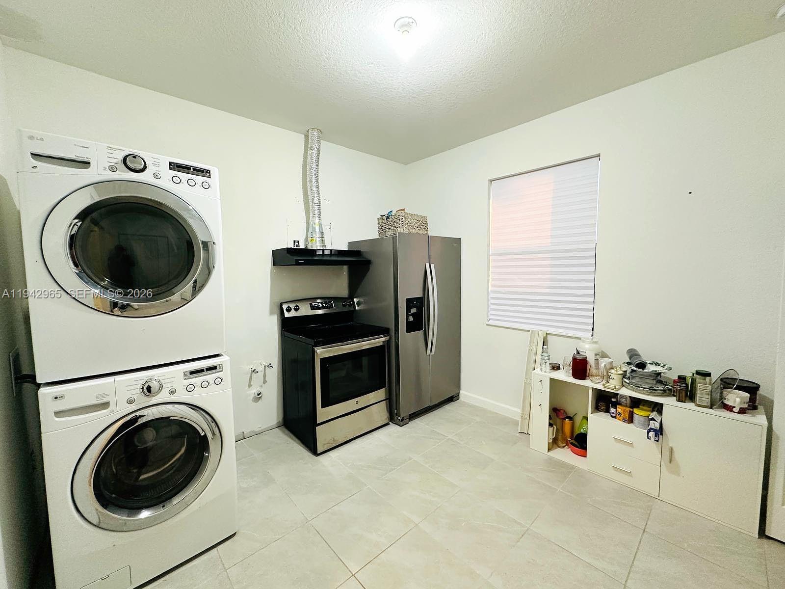23357 Southwest 133rd Avenue Homestead, FL 33032 - Photo 10 of 14 a view of kitchen sink and washer dryer