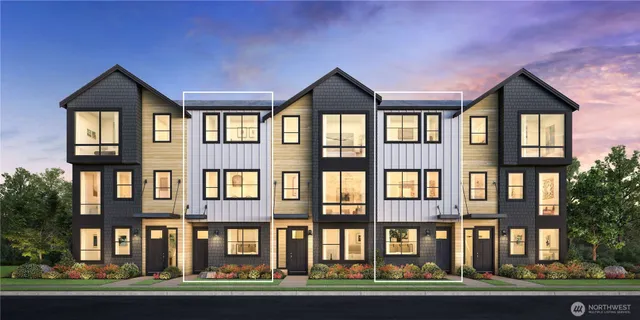 a front view of residential houses with street