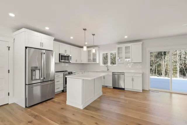 a bathroom with a sink toilet and vanity