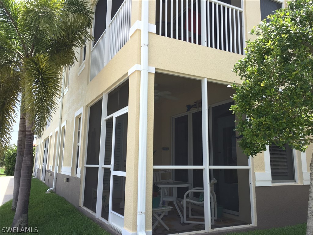 17210 Acapulco Road, Unit 211 Punta Gorda, FL 33955 - Photo 16 of 23 a view of a house with a yard