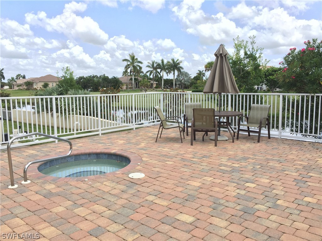 17210 Acapulco Road, Unit 211 Punta Gorda, FL 33955 - Photo 3 of 23 swimming pool view with a garden
