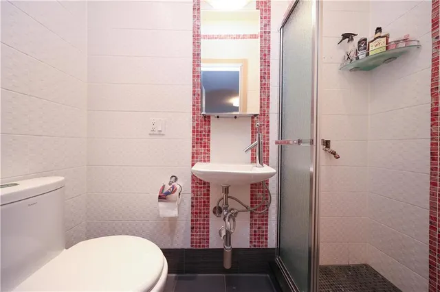 a bathroom with a sink and toilet