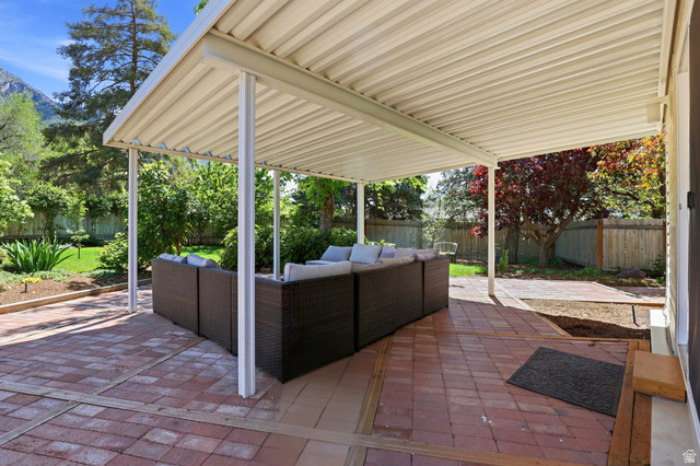 4245 3320 East Holladay, UT 84124 - Photo 36 of 51 Expansive covered patio featuring a corrugated metal roof supported by white posts