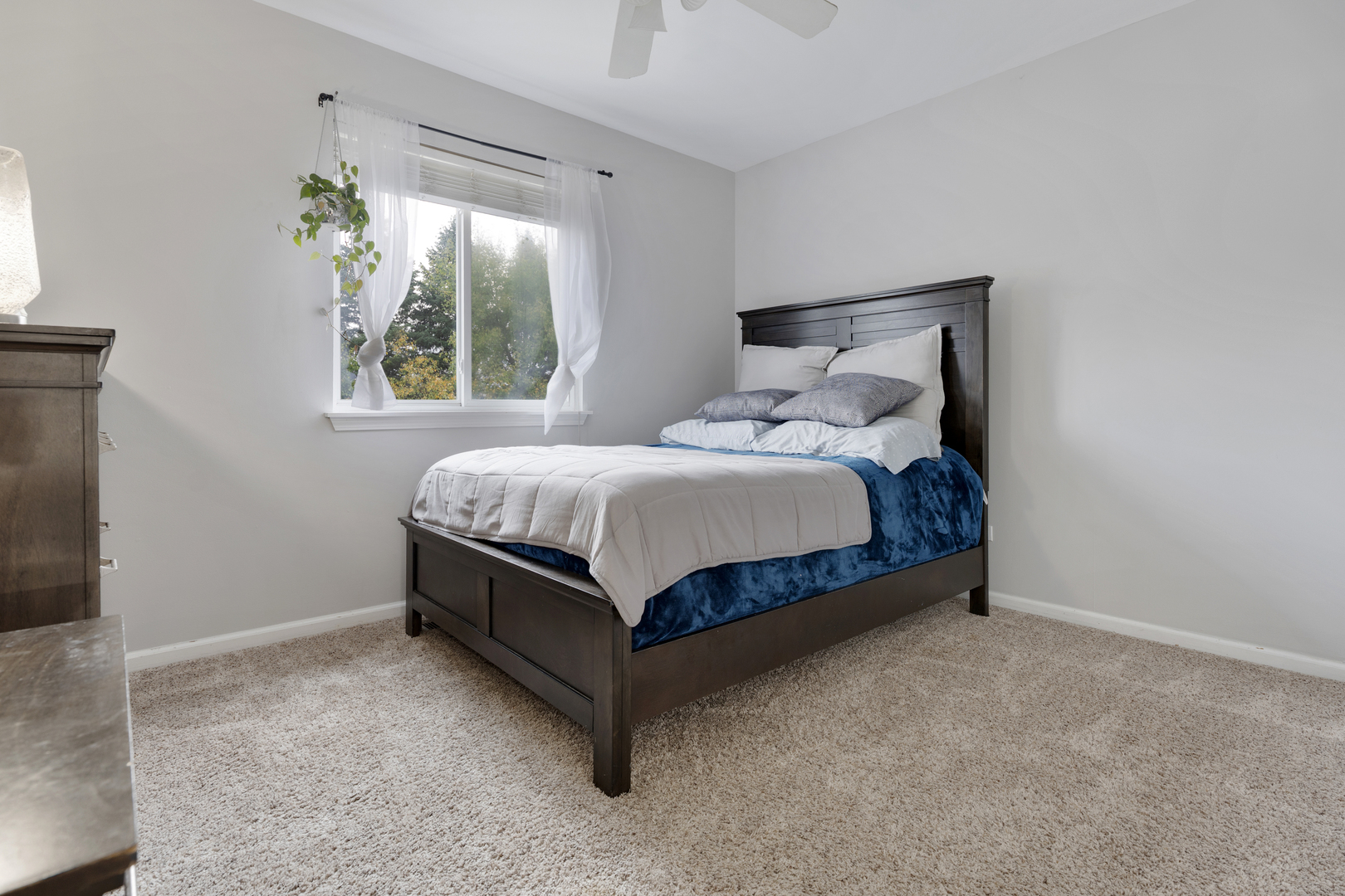 611 Woodbridge Drive Elgin, IL 60124 - Photo 16 of 28 a bed sitting in a bedroom next to a window