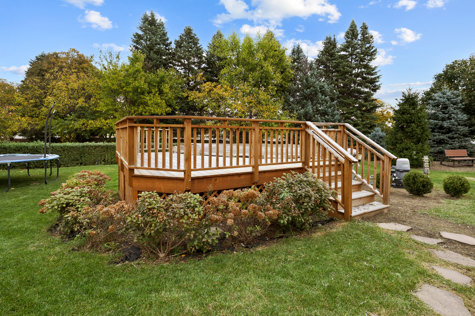 611 Woodbridge Drive Elgin, IL 60124 - Photo 20 of 28 a view of a wooden deck with a yard