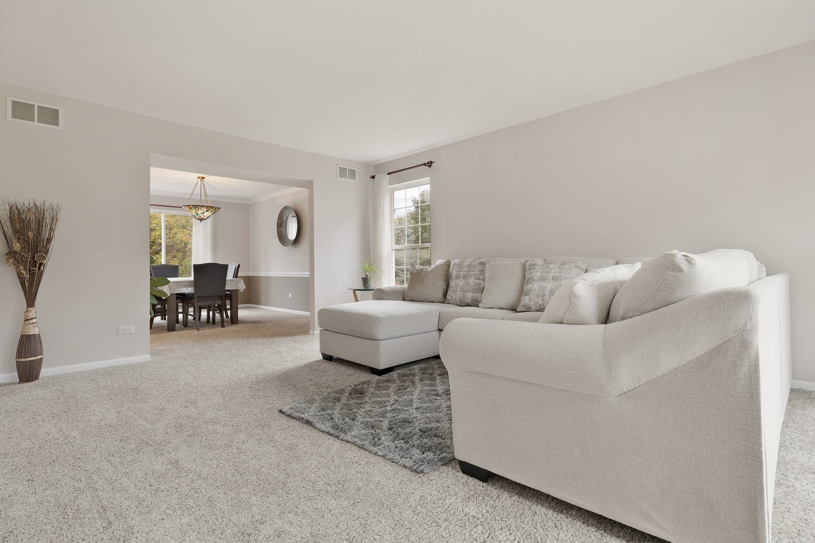 611 Woodbridge Drive Elgin, IL 60124 - Photo 24 of 28 a living room with furniture and a large window