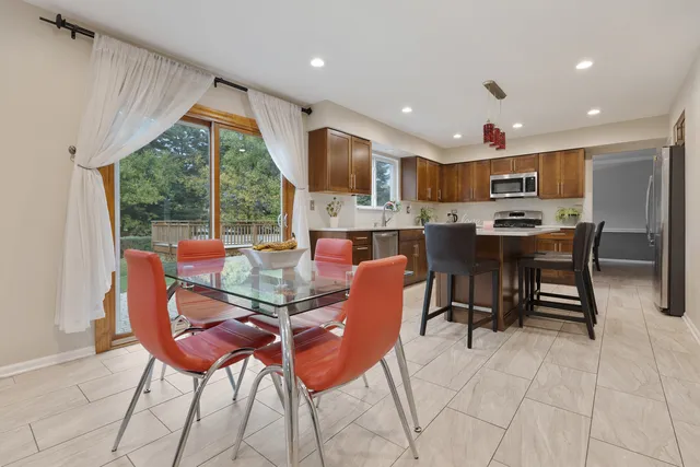 a view of a dining room with furniture window and outside view