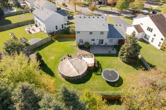 an aerial view of a house with swimming pool