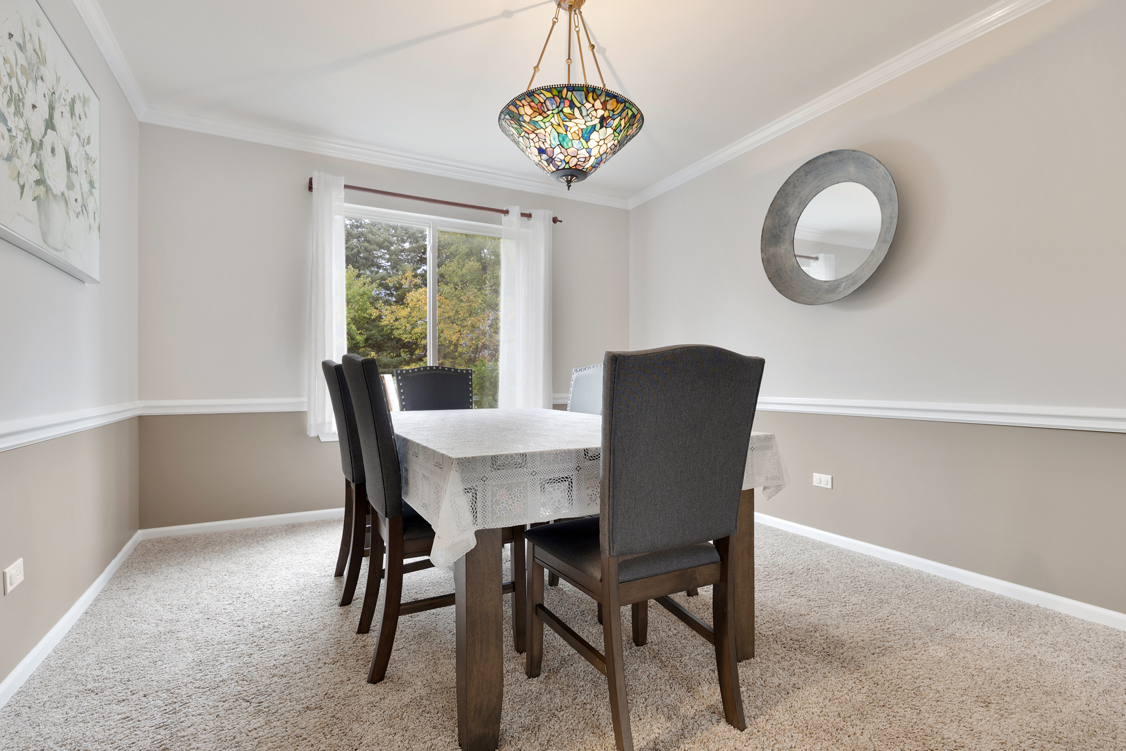 611 Woodbridge Drive Elgin, IL 60124 - Photo 8 of 28 a view of a dining room with furniture window and outside view