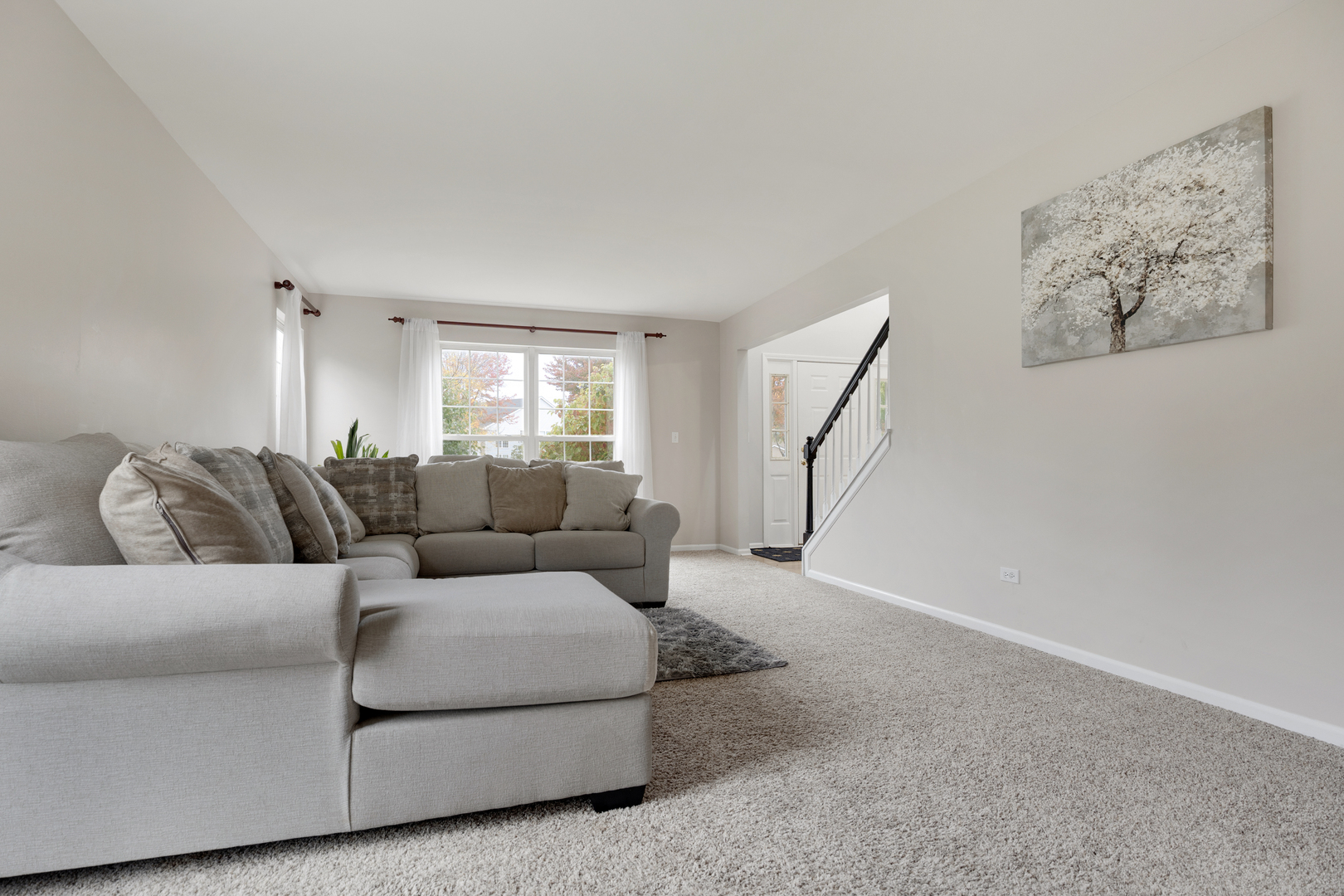 611 Woodbridge Drive Elgin, IL 60124 - Photo 9 of 28 a living room with furniture and a large window