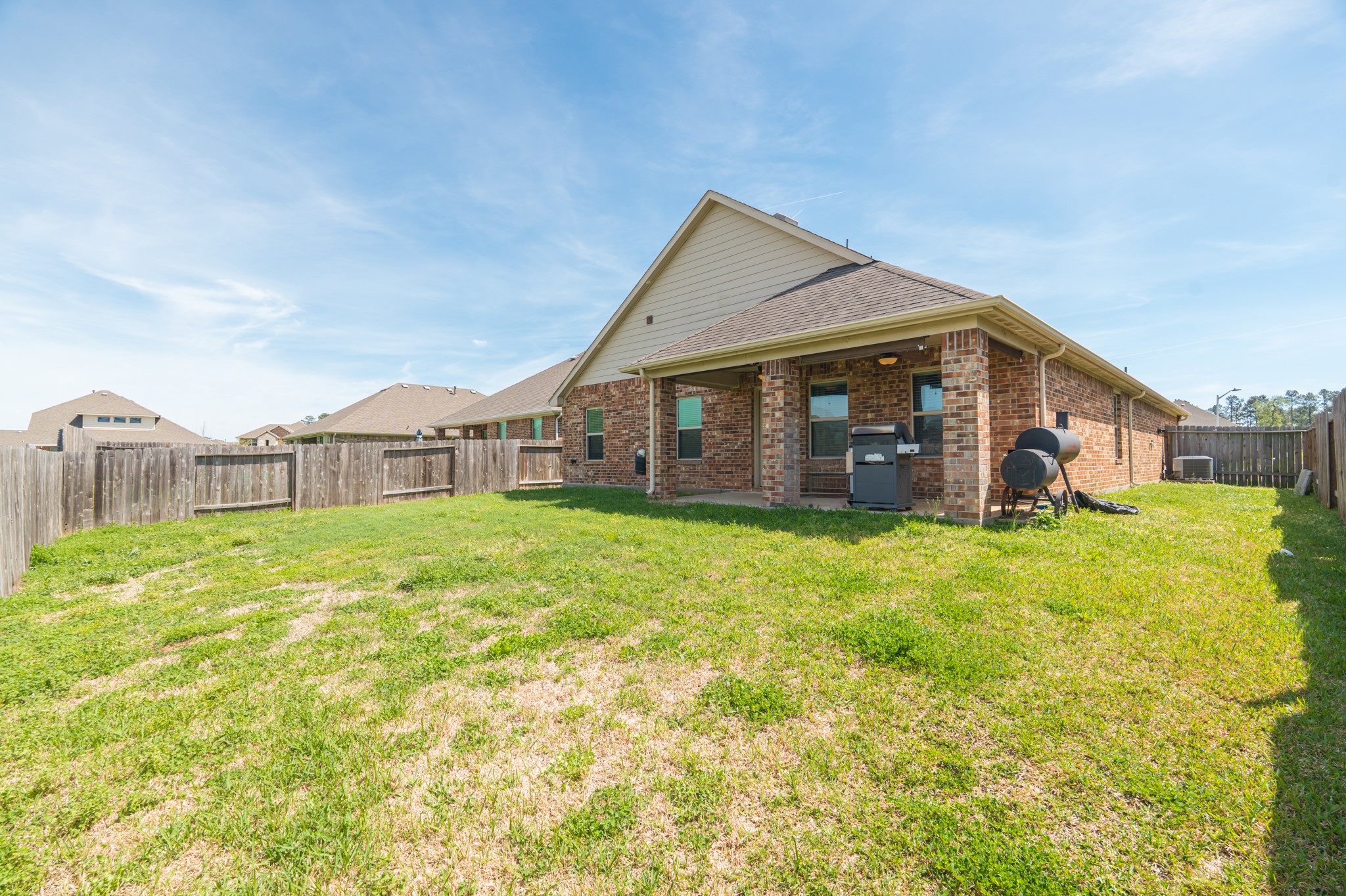 14207 Irvine Rnch Trail Conroe, TX 77384 - Photo 27 of 29 a front view of a house with garden