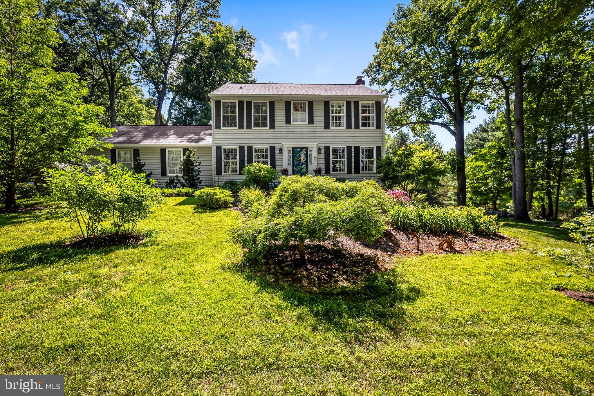 5026 Mt Carmel Road Hampstead, MD 21074 - Photo 2 of 57 a front view of a house with a garden