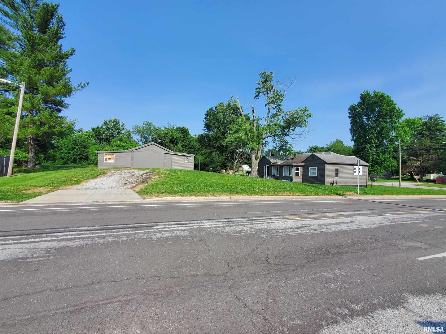 1902 Old W Main Street Carbondale, IL 62901 - Photo 2 of 2 a green field with some trees in the background