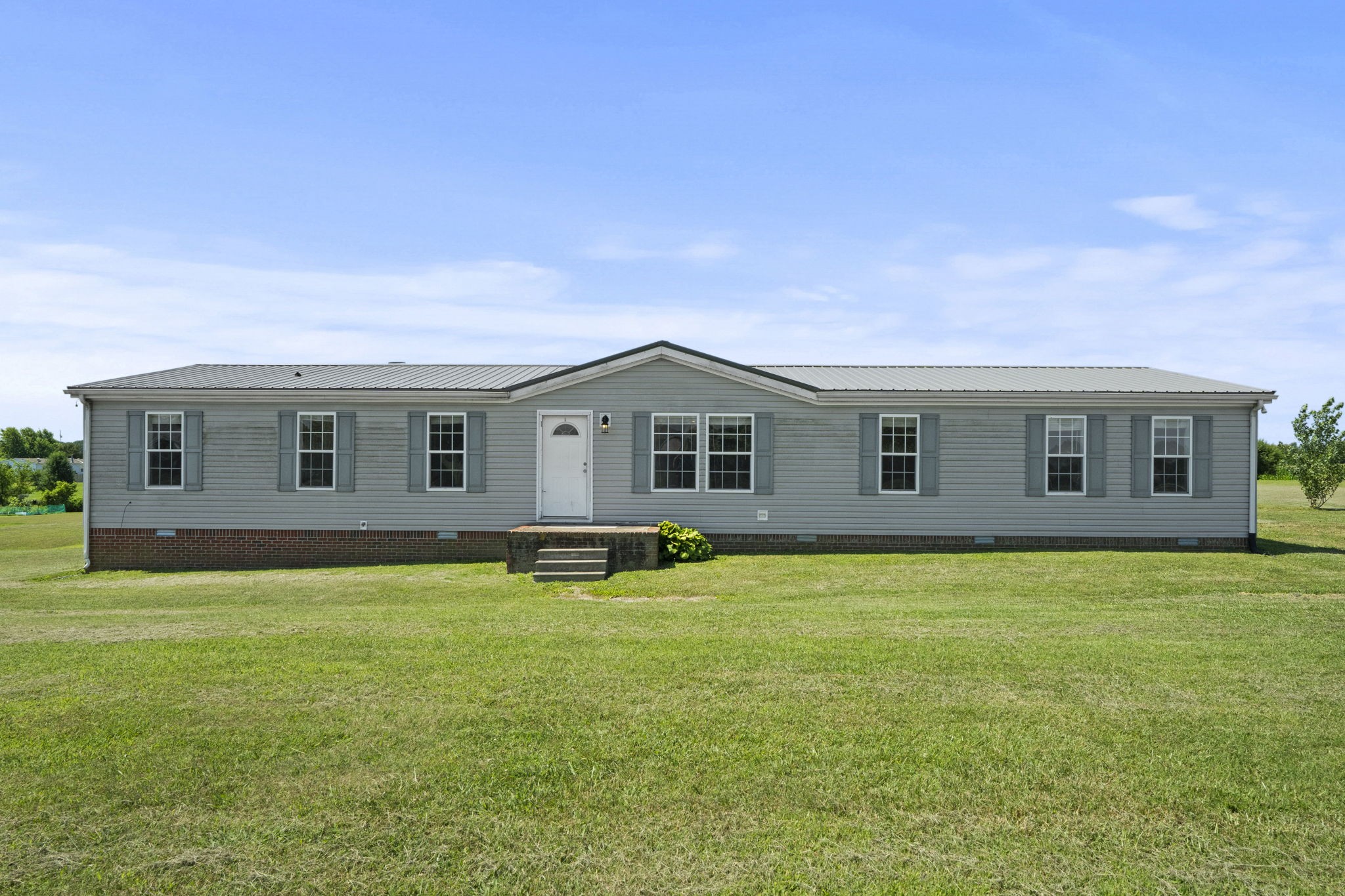 579 Cook Road Portland, TN 37148 - Photo 1 of 34 a backyard of a house with table and chairs