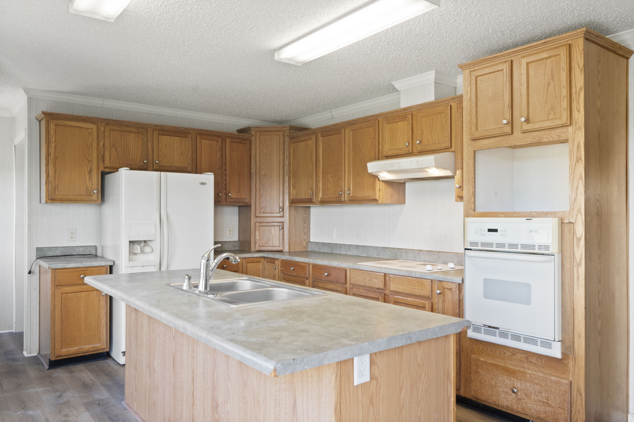579 Cook Road Portland, TN 37148 - Photo 19 of 34 a kitchen with a sink a stove and a refrigerator