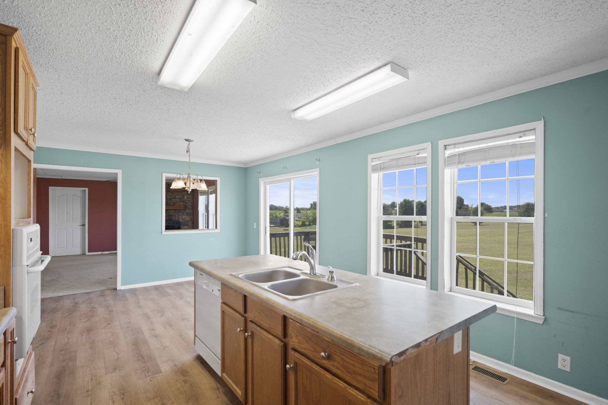 579 Cook Road Portland, TN 37148 - Photo 21 of 34 a open kitchen with granite countertop a sink and a stove top oven