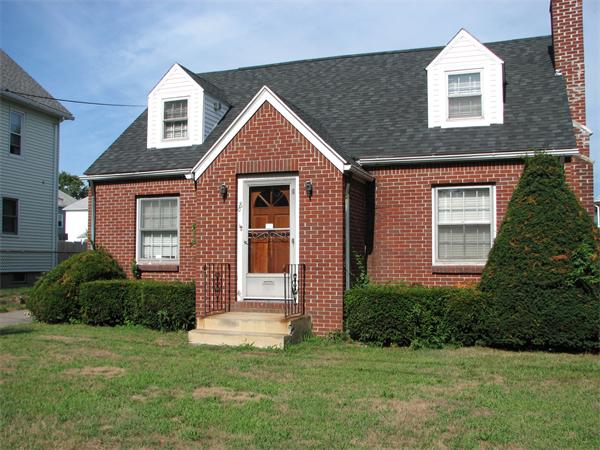 68 Montgomery Street Springfield, MA 01151 - Photo 1 of 15 a front view of a house with a yard