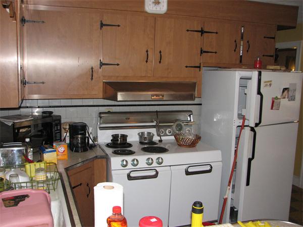 68 Montgomery Street Springfield, MA 01151 - Photo 11 of 15 a kitchen with refrigerator and cabinets