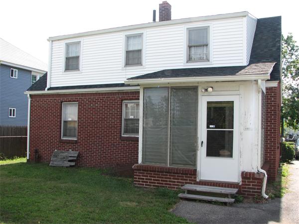 68 Montgomery Street Springfield, MA 01151 - Photo 13 of 15 a front view of a house with a garden