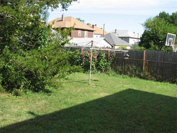 68 Montgomery Street Springfield, MA 01151 - Photo 14 of 15 a view of a house with a backyard